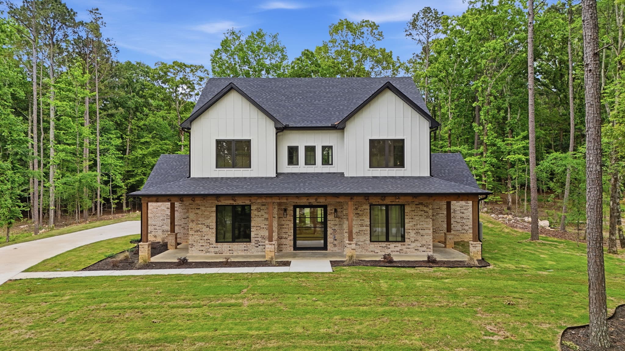 New construction home on a wooded lot in Bryant, Arkansas, photographed by Avery & Bryant