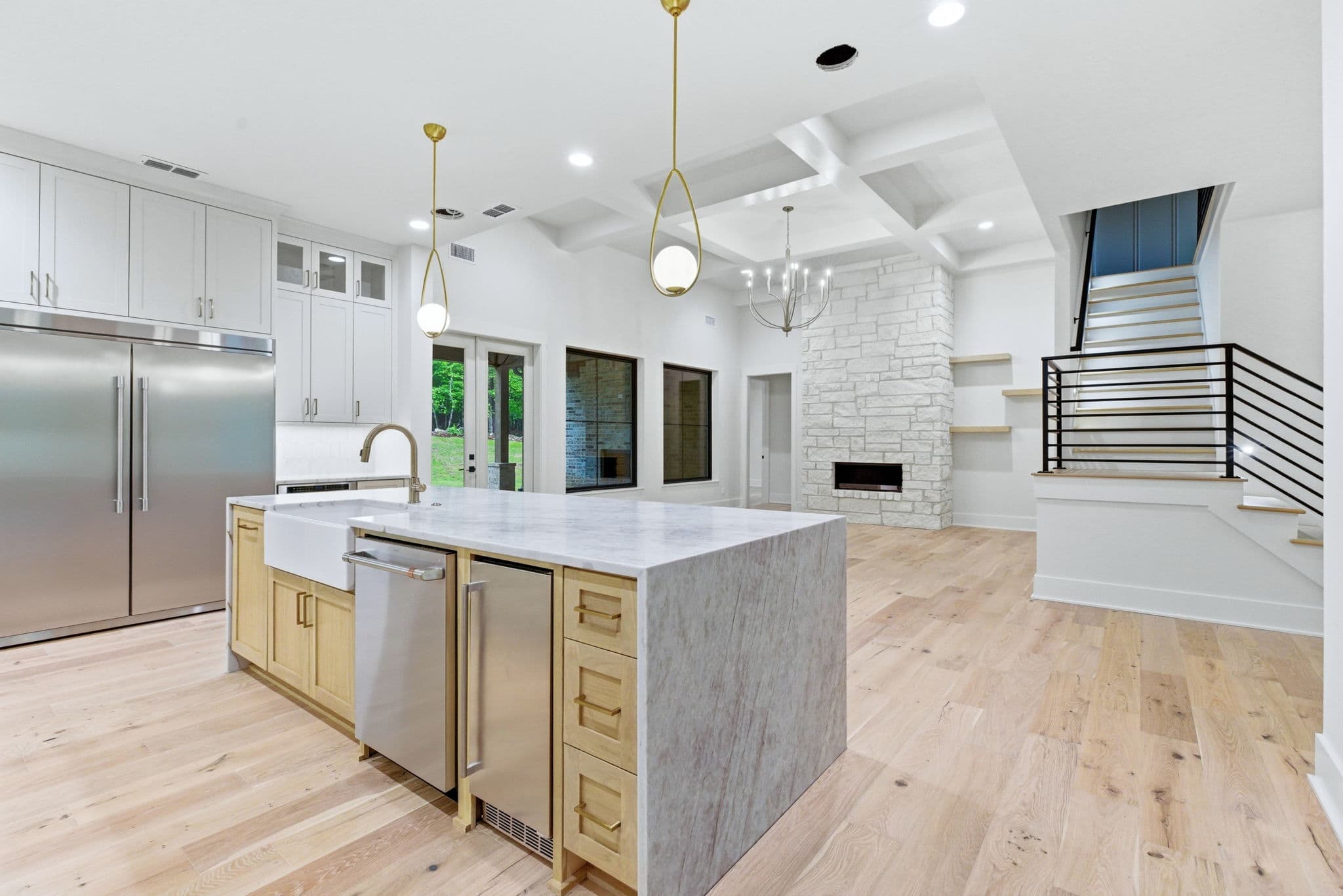 White oak kitchen with black windows in a new construction home in Bryant, Arkansas