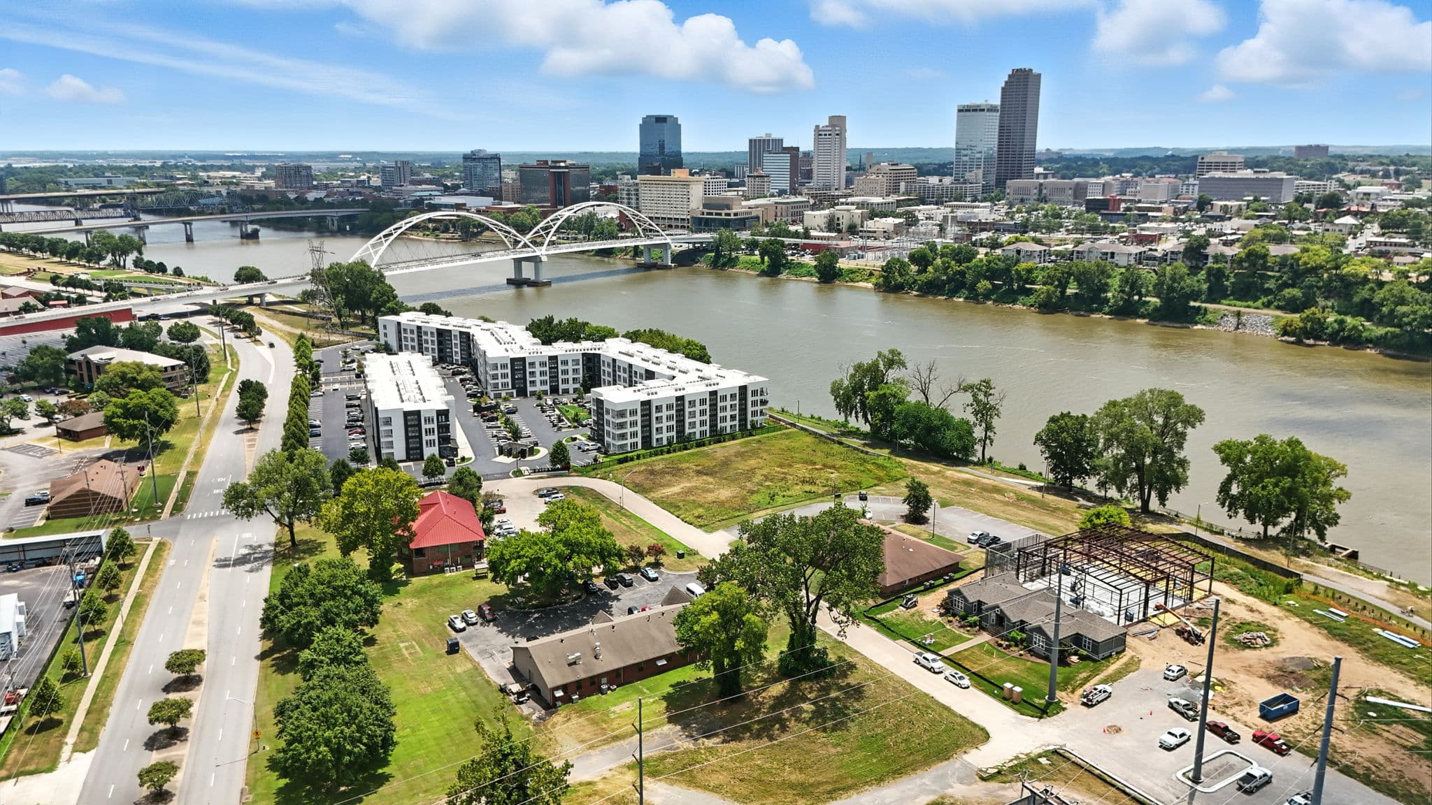 Aerial photo over the Arkansas River showing the Little Rock skyline and its bridges, from a commercial shoot in North Little Rock, Arkansas