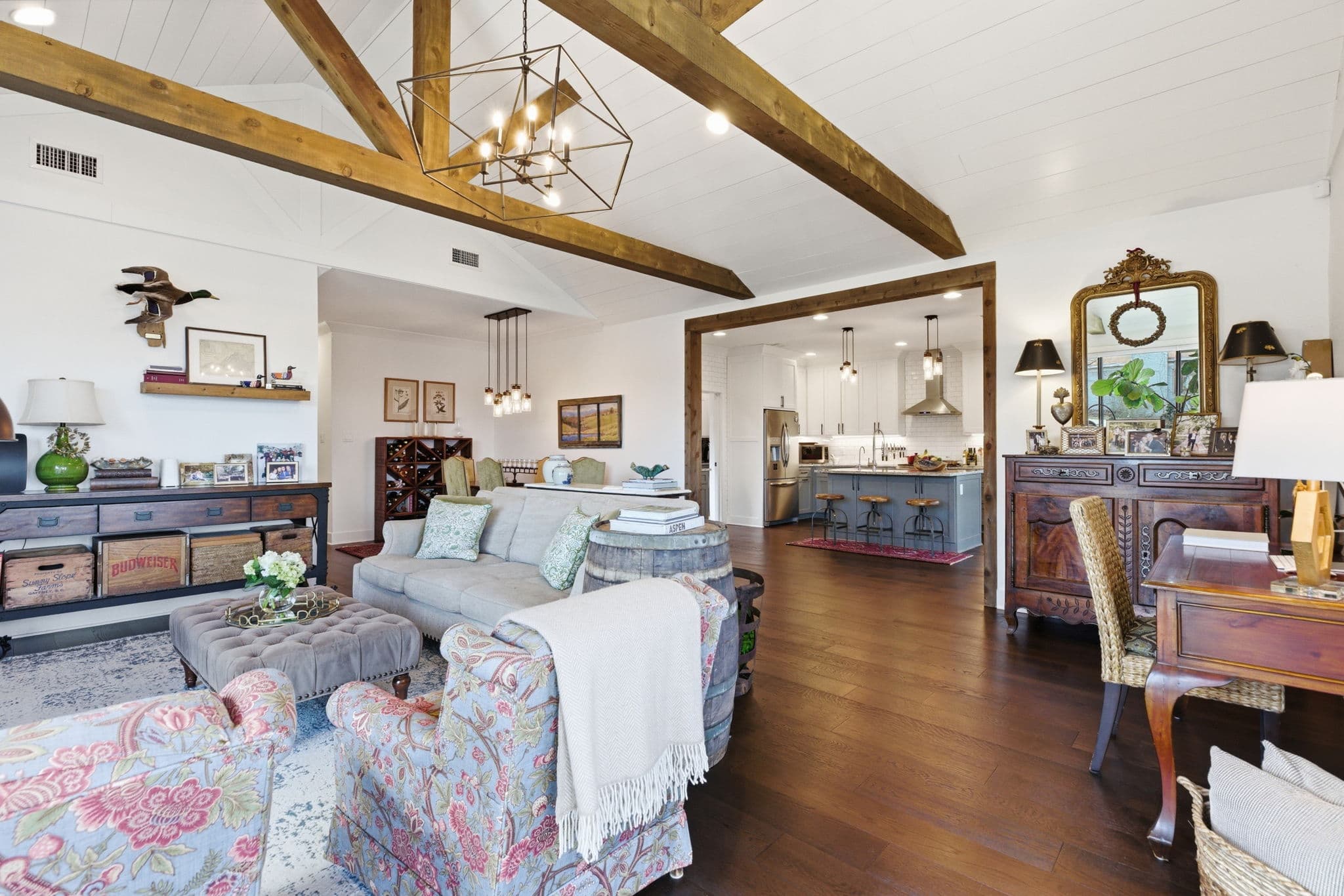 Designer furnished great room with exposed beams in a single family listing in Little Rock, Arkansas